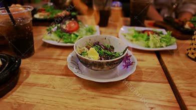 Closeup Plate with Burning out Food Beverages on Table