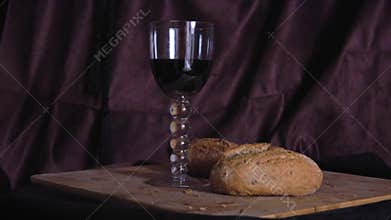 Glass of red wine and bread still life