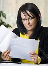 Woman reading paperwork