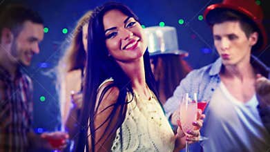 Nightlife of girl dancing and drinking champagne in night club