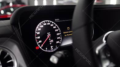 Luxury car dashboard, electronic speedometer. High tech control panel. close-up .
