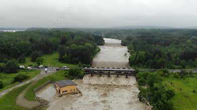 Disaster.Breakthrough of the dam.Catastrophe.Fast flowing raging river.