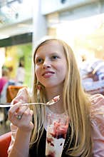 Girl eating a dessert