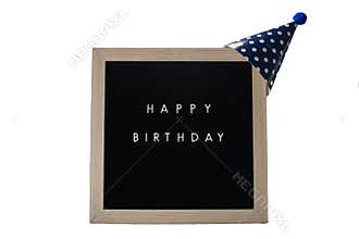A Black Sign With a Birch Frame That Says Happy Birthday With a Blue Polka-Dotted Party Hat on Top