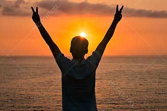 A Happy Man Celebrating Victory at Sunrise