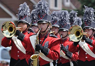 High School Marching Band Performing in Parade