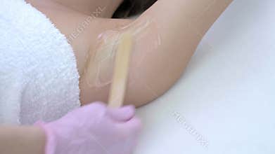 Close-up 4K video of adult woman receiving laser hair removal