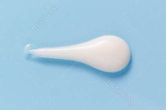 White cleansing foam gel drop on pastel blue. Hygiene, skincare product creamy texture