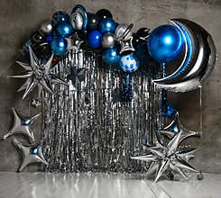 Space balloons photo zone with blue and silver stars for child kids birthday party decor. Holiday decoration