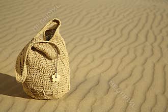 Beach bag on a sand dune