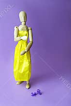 Concept of gender dysphoria and transgenders. Gestalta wearing a yellow dress.