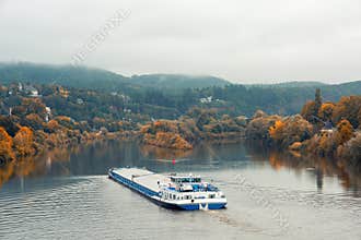 A barge navigates the Mosel River near Trier, Germany