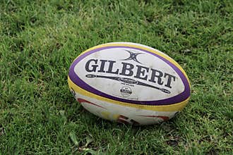 Gilbert Rugby Ball on Grass