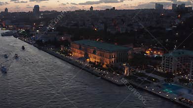 Beautiful Ciragan Palace Kempinski on Riverside of Bosphorus in Istanbul at Dusk, Aerial View