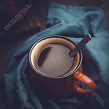 Strong aromatic coffee in a red mug