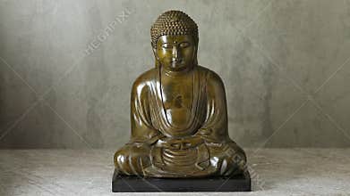 Smoke of incense in front of a traditional Asian buddha