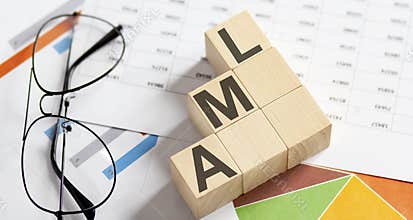 AML words with wooden blocks. Business concept