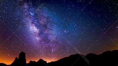 Lyrids Meteor Shower and Milky Way Galaxy Above Volcanic Rocks in Fossil Falls Sierra Nevada Mountains California USA