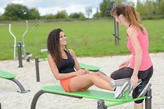 Friends in public fitness area
