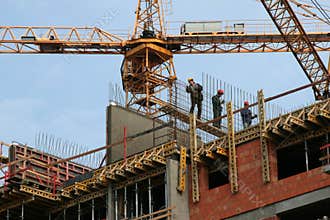 Construction workers on a scaffolding house