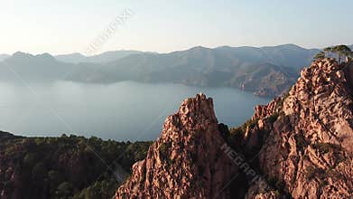 Calanche of Piana, west Corsica, mounts on sea, scenic road at sunset.