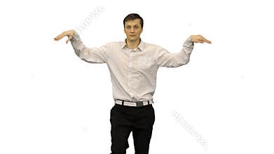 Young man in white shirt dancing a modern dance with bent arms on white background.
