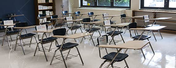 High school classroom ready for students to return with signs on chairs not to be used