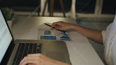 Freelance Asia lady using laptop hard work in living room at house.