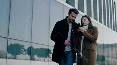 Architect woman show to customer buildings for sale.
