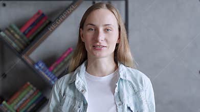 Woman looking at camera and talking, making video call conference, online job interview at home.