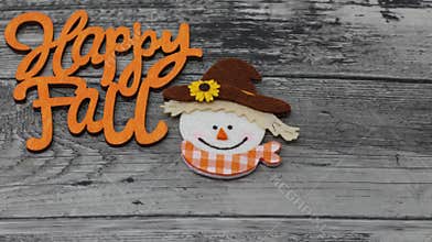 Happy fall message with smiling scarecrow