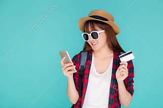 Beautiful portrait young asian woman wear travel summer fashion holding credit card and smart mobile phone in summer