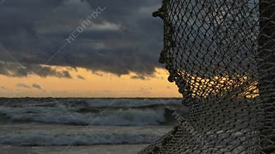 Old Fishing Net Hanging on Seaside