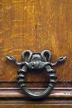 Metal snake door knocker
