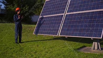 Woman wearing helmet using tablet