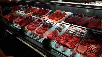 Raw meat on display at butcher shop in Rome, Italy
