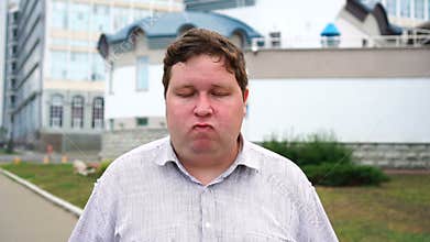 Young handsome man says no and nods his head. Portrait outdoor
