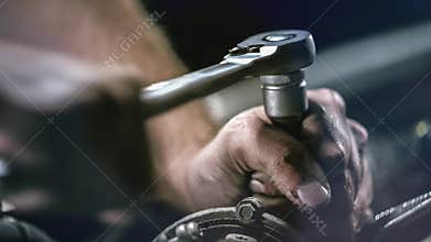 Auto mechanic working in garage. Repair service