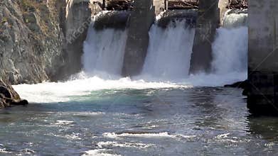Hydroelectric power station, water flowing and falling, alternative ecologic energy, fast mountain river on a sunny