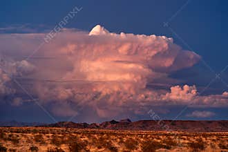 Supercell thunderstorm cumulonimbus cloud at sunset