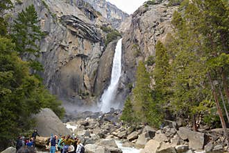 People visit lower Yosemite Falls in Yosemite National Park, California, USA
