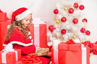 Christmas and new year holiday. Writing letter to santa claus. Winter tradition. Kid cute girl writing email letter on