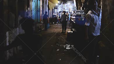 People at street passage in Varanasi in night time