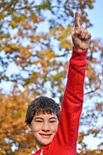 Boy Pointing Finger Up to Sky