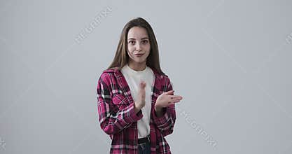 Bored teenage girl clapping in sarcastic way