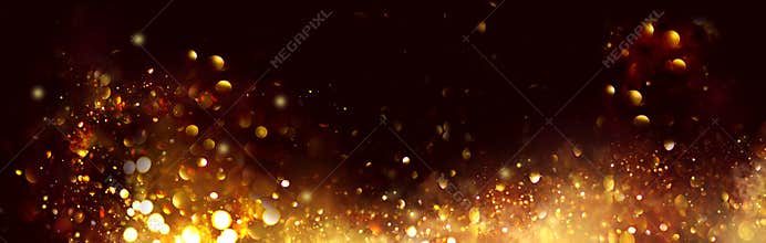 Golden Christmas and New Year glittering stars swirl on black bokeh background, backdrop with sparkling golden stars
