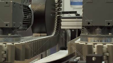 Closeup of automated machine in a production line.