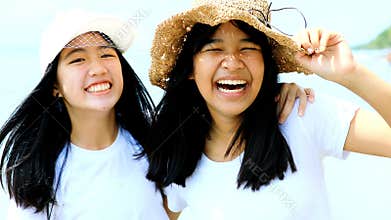 Toothy smiling face of two asian teenager happiness emotion