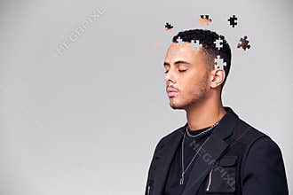 Mental Health Concept Of Young Man With Jigsaw Shaped Pieces Missing From Mind