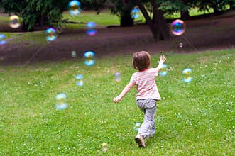 Child playing with bubbles